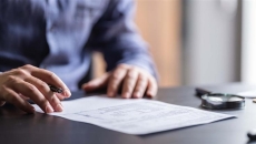 Person signing a contract