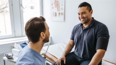 Patient sitting with a healthcare professional