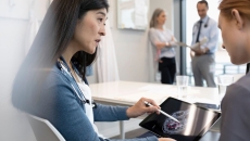 Clinicians discussing diagnostic scan findings