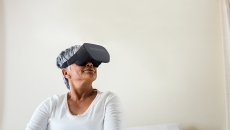 A woman wearing an AppliedVR headset