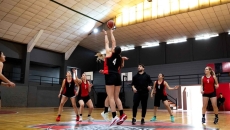 Women playing basketball