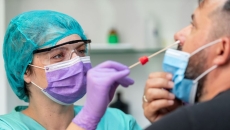 A provider conducting a COVID-19 test.