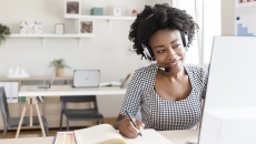 Healthcare worker engaging with someone via a PC