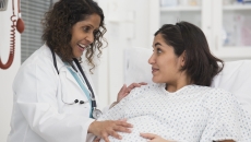 Healthcare provider evaluating a pregnant person