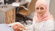 Technician performing ultrasound procedure