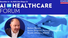 Robert Havasy at HIMSS_Doctor looking at brain scan on table Photo: katleho Seisa/Getty Images