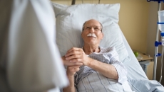 Healthcare professional consulting with patient in the hospital