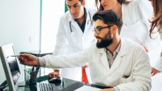 Clinicans looking at screen