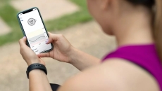 A Dexcom user checking their blood glucose level in real-time via mobile app