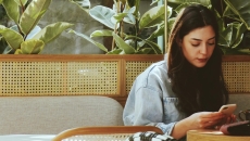 A young person using their smartphone