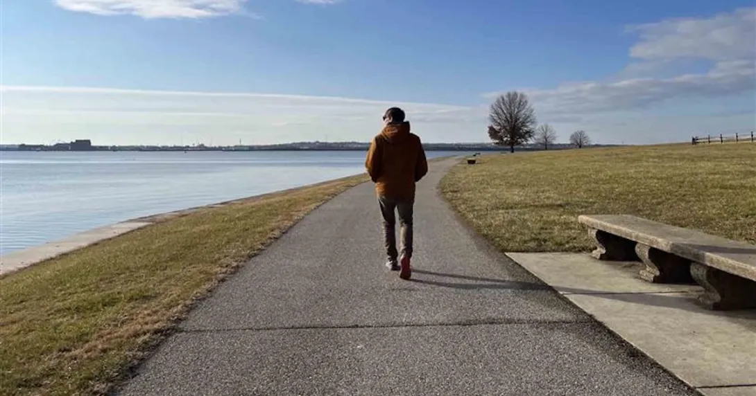 Person walking near an ocean