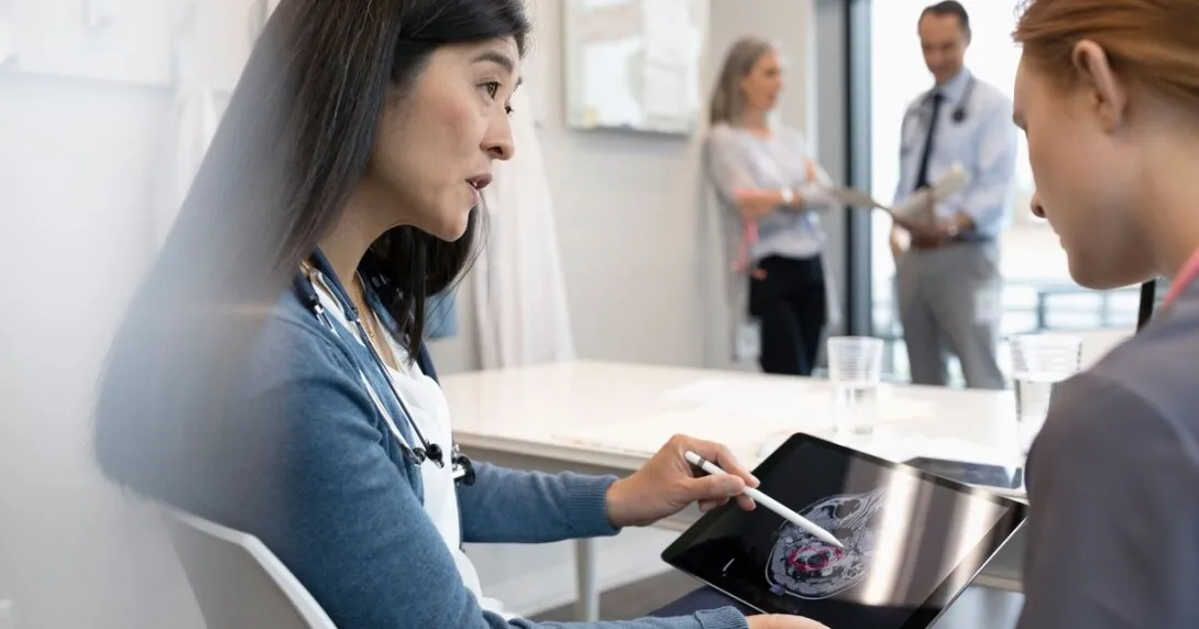 A doctor explaining findings from a brain scan to a patient 