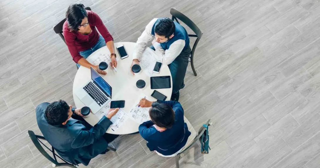 People having a business meeting at a roundtable