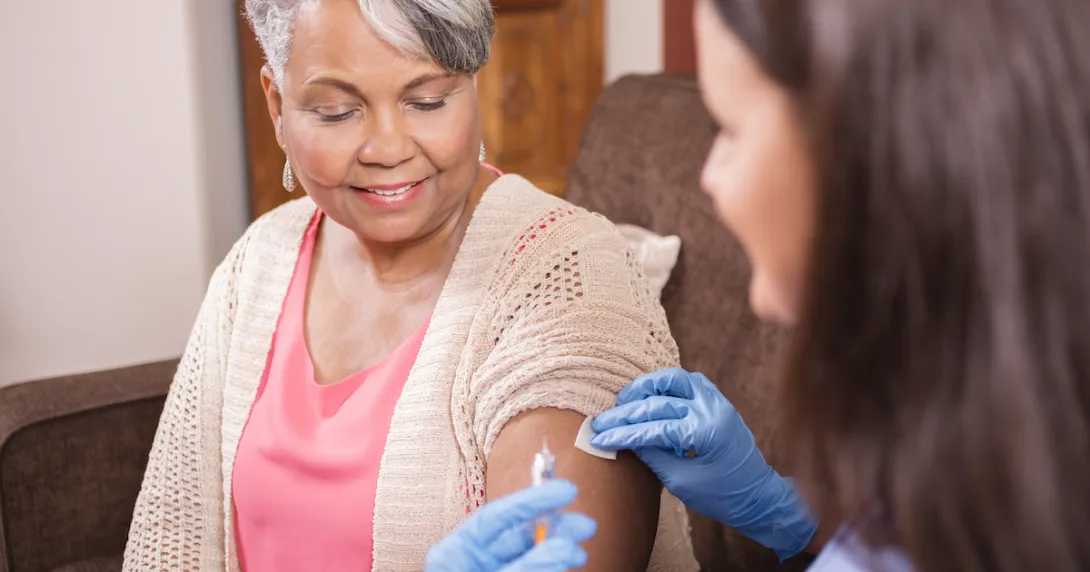 Nurse with a syringe and a patient