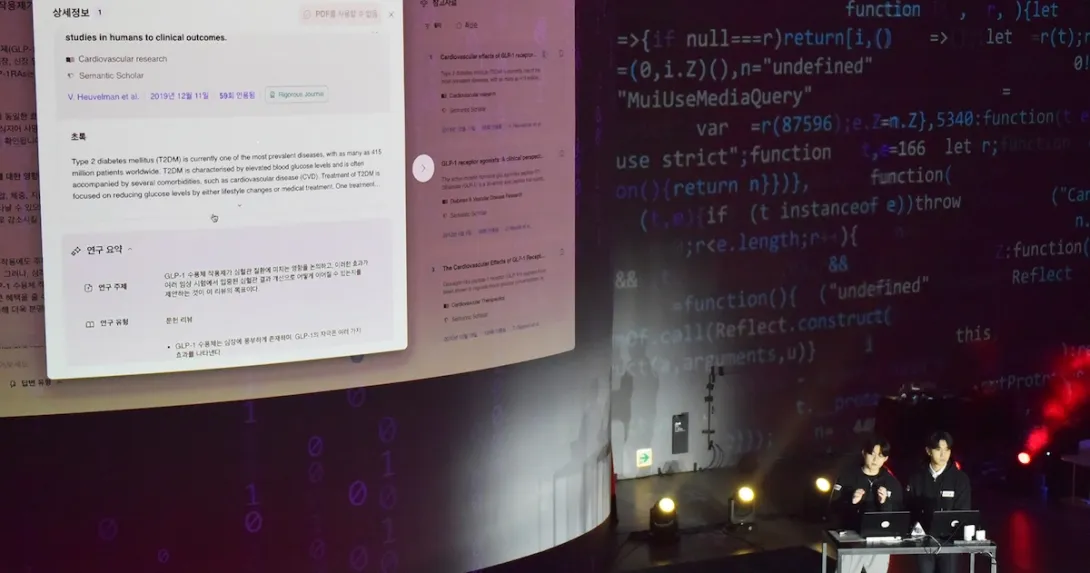 PhnyX representatives demonstrating the genAI chatbot Cheiron
