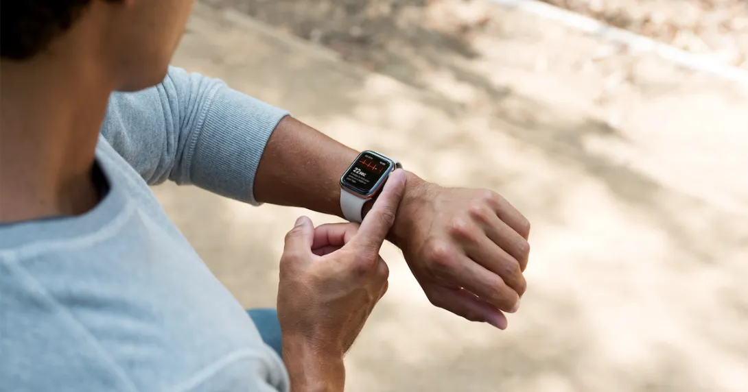Person taking an ECG reading on an Apple Watch