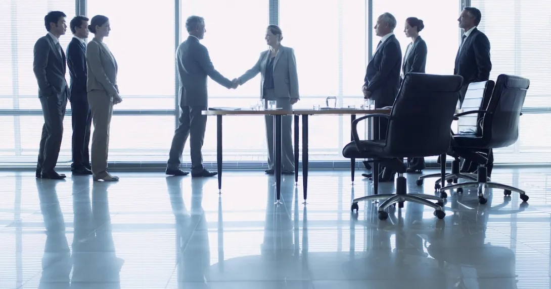 Executives discussing business deal