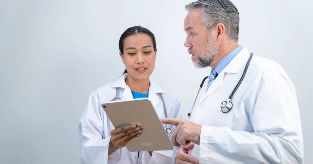 Clinicians reviewing patient record