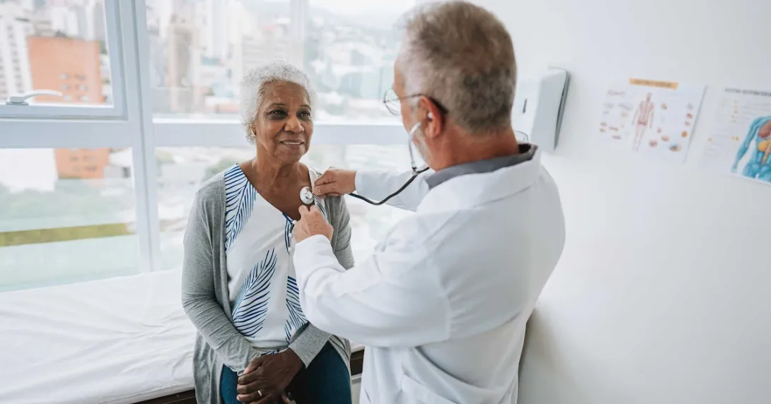 Doctor listening to a patients heart with a stethoscope