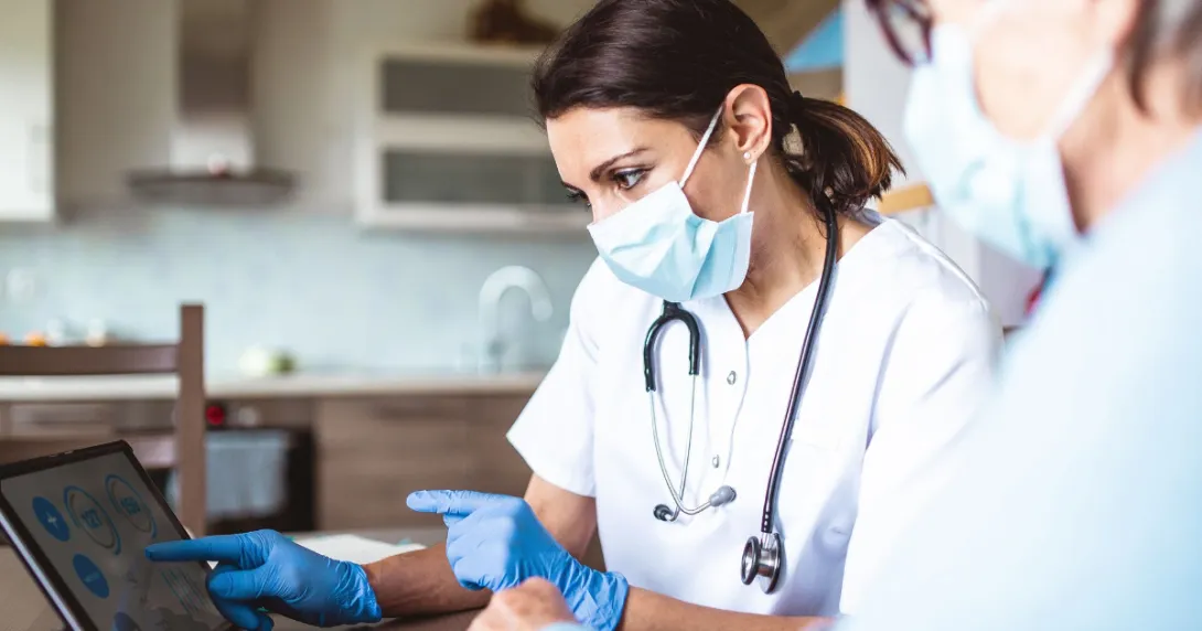 Two people looking at a tablet