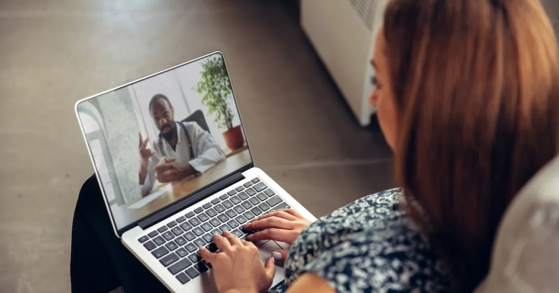 Patient consulting with healthcare professional virtually