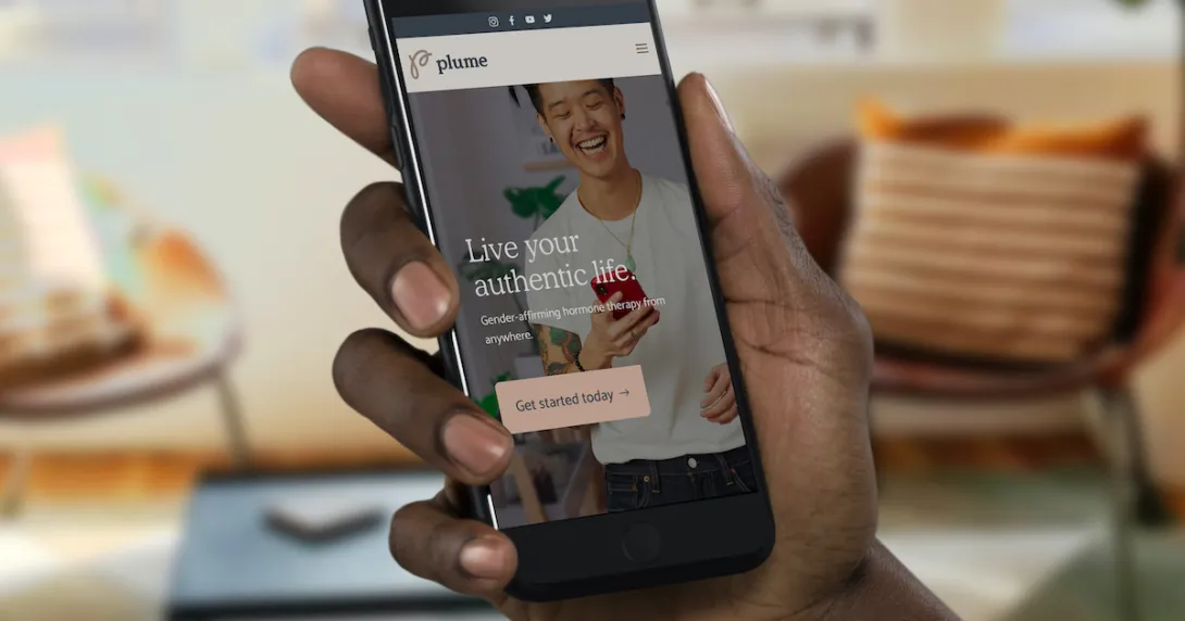 A closeup of a hand holding a smartphone displaying the Plume app.