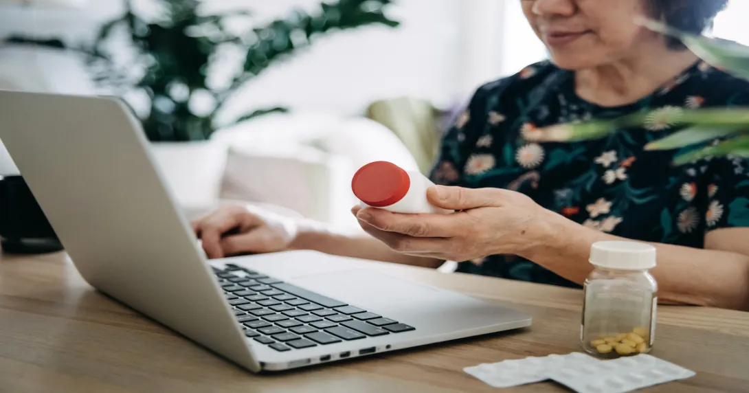 A woman looking up prescription prices online